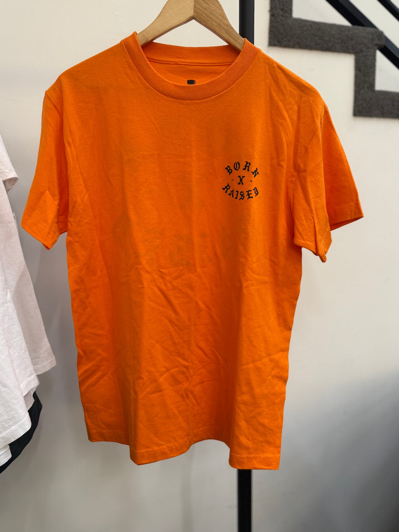 BORN X RAISED ON THE TURF BXR ROCKER TEE (ORANGE)