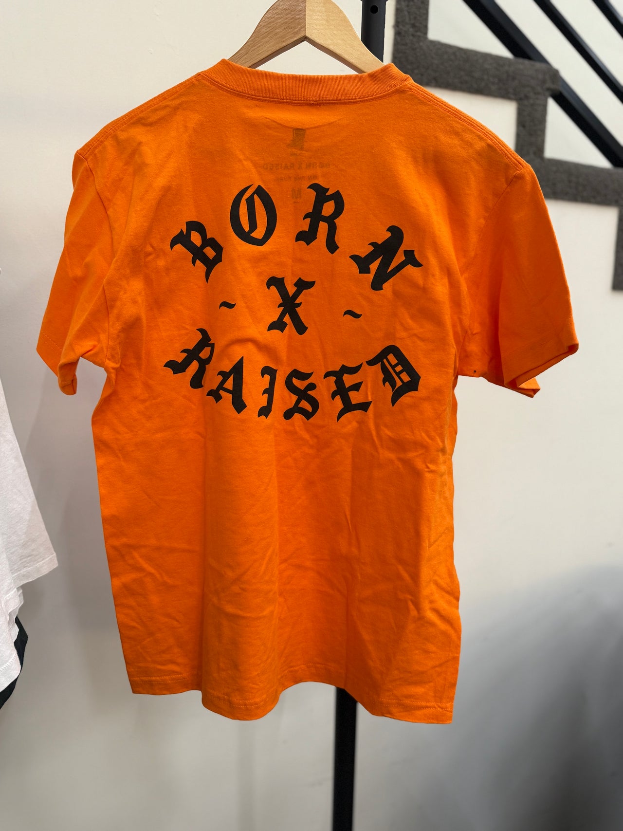 BORN X RAISED ON THE TURF BXR ROCKER TEE (ORANGE)